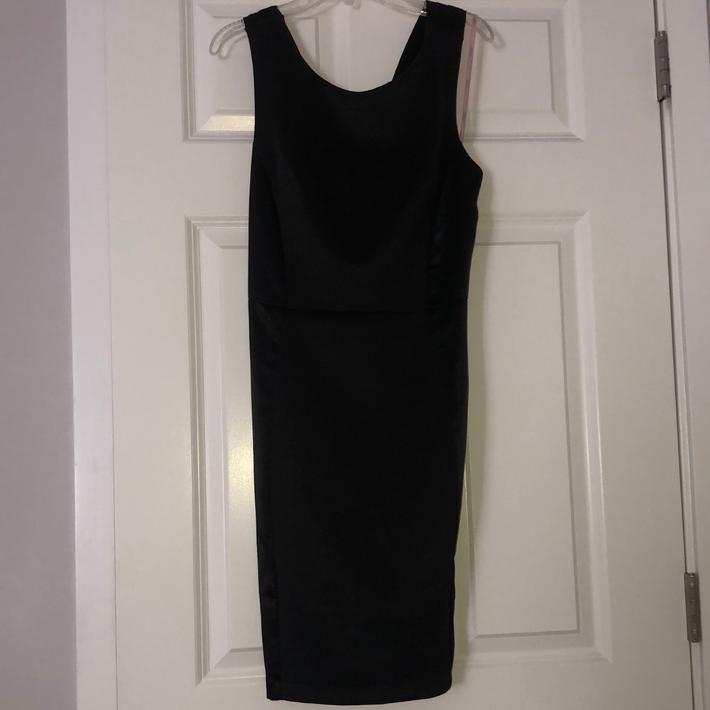 Simple black dress. Size Medium. Never worn.
